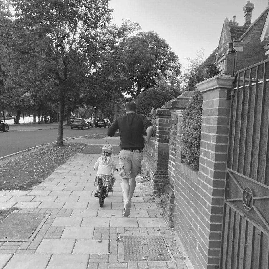 Father & daughter learning to cycle original photo
